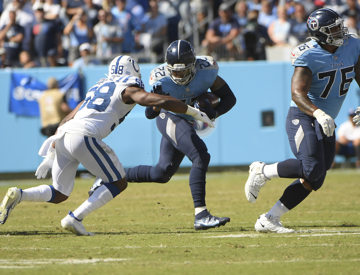 Nashville, Tennessee, USA; Tennessee Titans running back Derrick Henry (22) runs the ball as Indianapolis Colts inside linebacker Bobby Okereke (58) chases during the second half at Nissan Stadium.